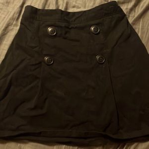 Short black skirt with decorative buttons